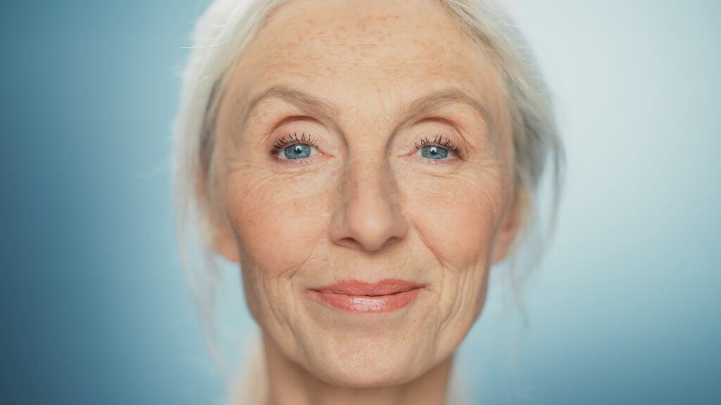 Medium,Portrait,Of,Beautiful,Senior,Woman,Looking,At,Camera,And